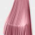 Wide pleated high-waist midi skirt in soft blush pink with a flowing silhouette