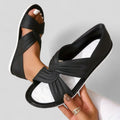 Flat cross-front sandals with a back strap in black, beige and red