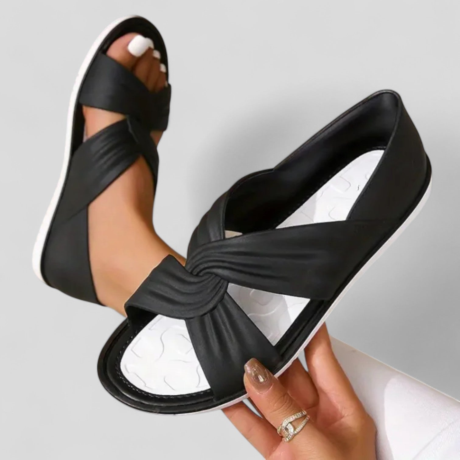 Flat cross-front sandals with a back strap in black, beige and red