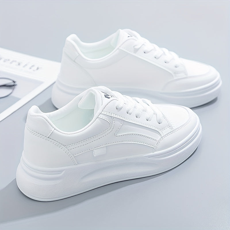 A woman in crisp white light comfort trainers paired with jeans.