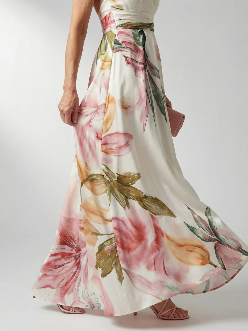 White floral halter-neck maxi dress with large bold print and flowing relaxed skirt