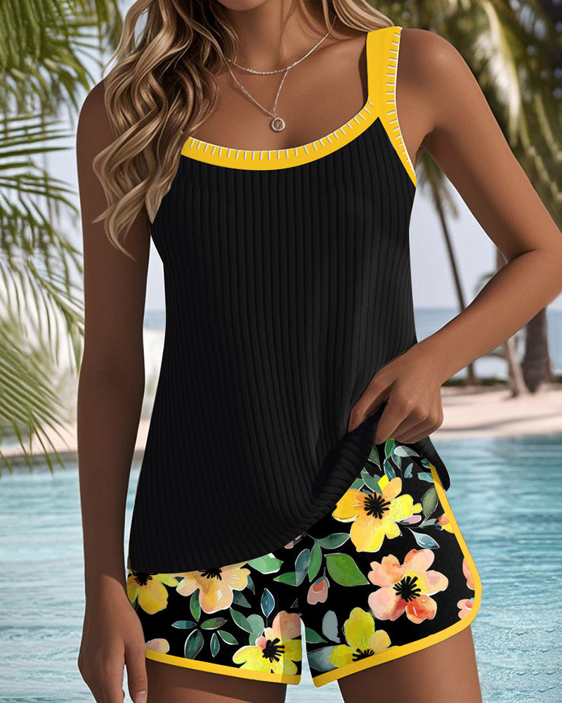 Tankini set with orange tropical-print shorts and matching top