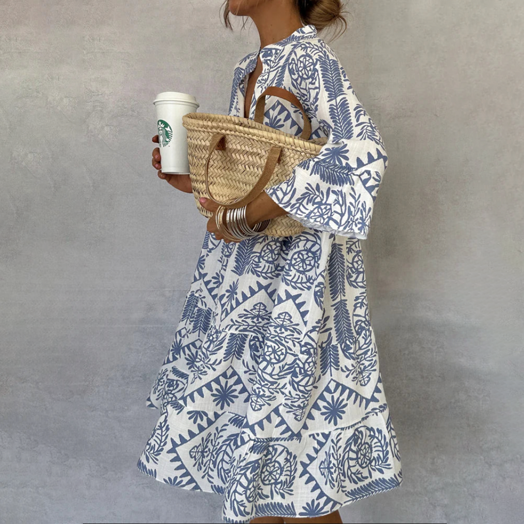 Woman wearing the Vivienne button-front boho tunic dress, relaxed on a casual day out.