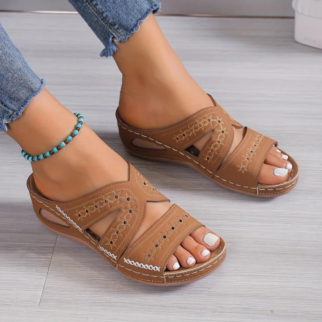 Women's crossover backless sandals with a cushioned footbed, shown in multiple summer colours