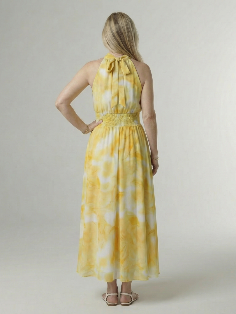 Yellow halter neck midi dress with a ruched waist detail in a clean, simple silhouette