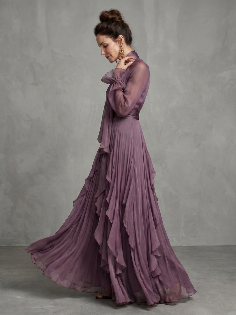 Purple long-sleeve maxi dress with a bow neckline and full layered ruffle skirt