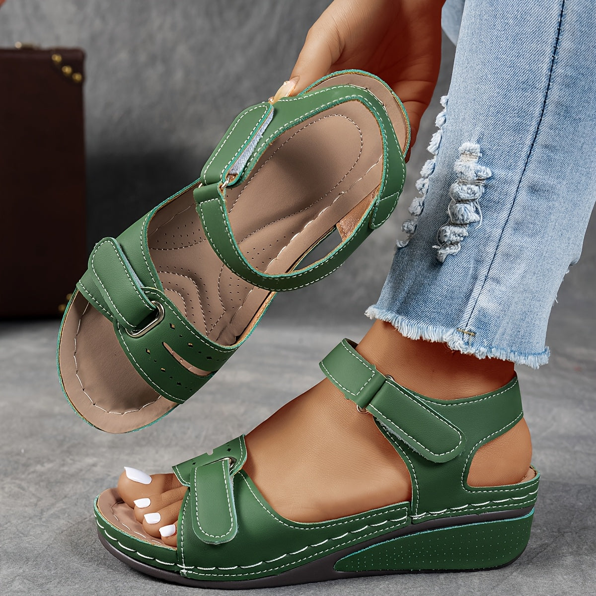 Wedge sandals with three adjustable velcro straps in a warm camel tone