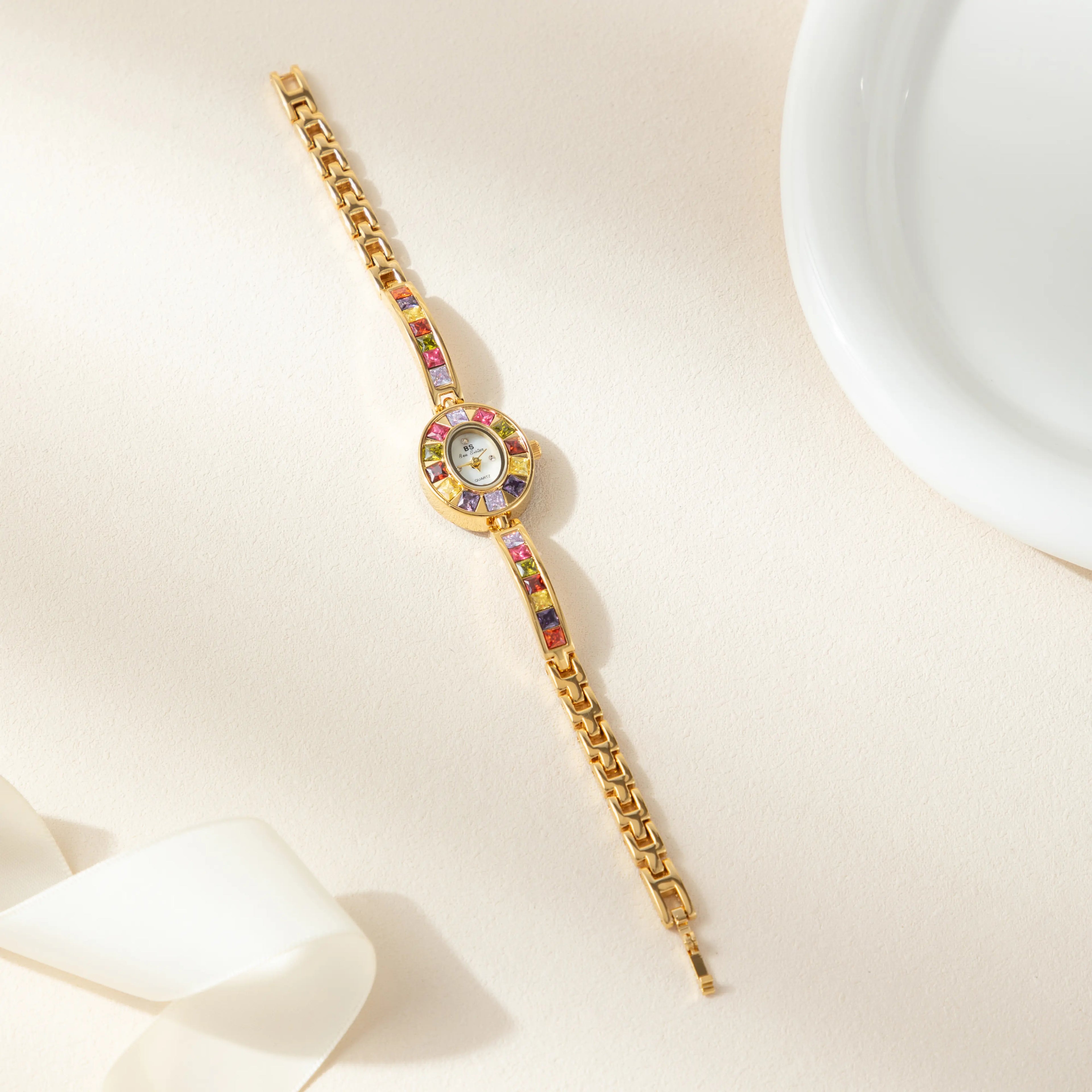 Women's colourful watch with golden detail trim in gold tones