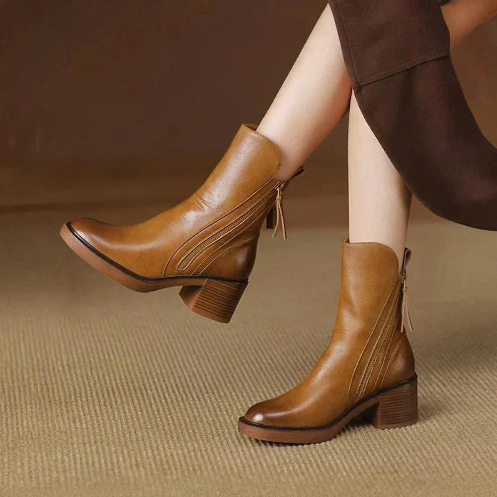 Classic black ankle boots with a stable heel and side zip fastening