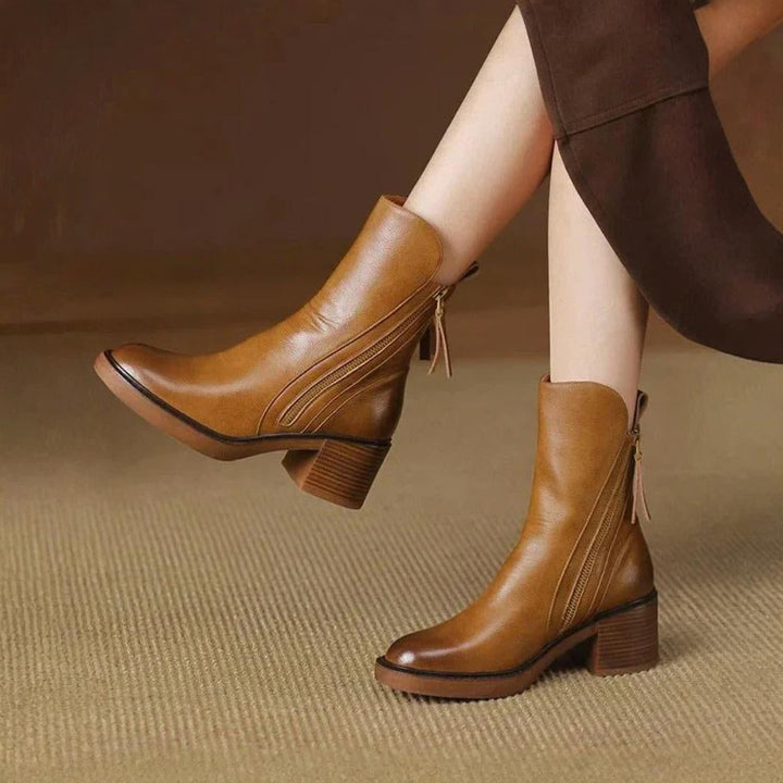 Classic black ankle boots with a stable heel and side zip fastening