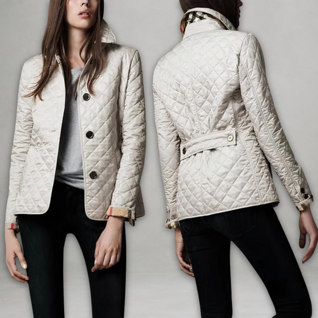 A woman wearing an autumn jacket over a top, layered for a crisp day in town.