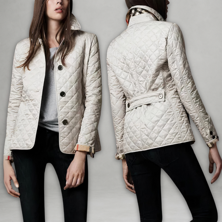 A woman wearing an autumn jacket over a top, layered for a crisp day in town.