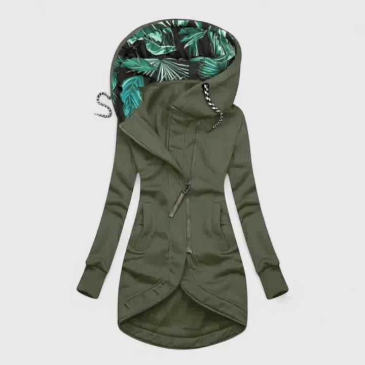 A navy hooded zip-up jacket with a leaf-print hood lining and a longer curved hem