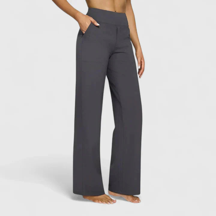A woman in elegant straight-leg trousers with pockets, styled for a polished everyday look.