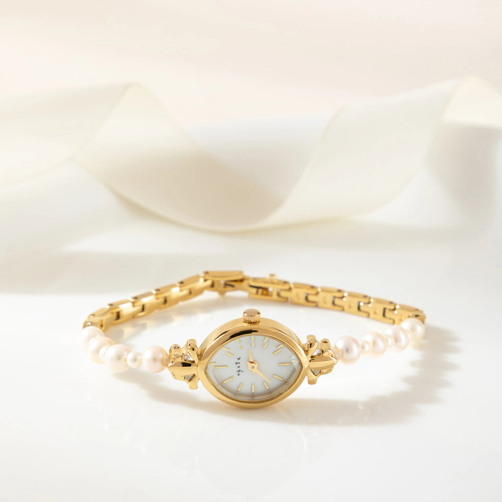 Elegant women's watch with crystal-set dial and delicate golden bracelet strap
