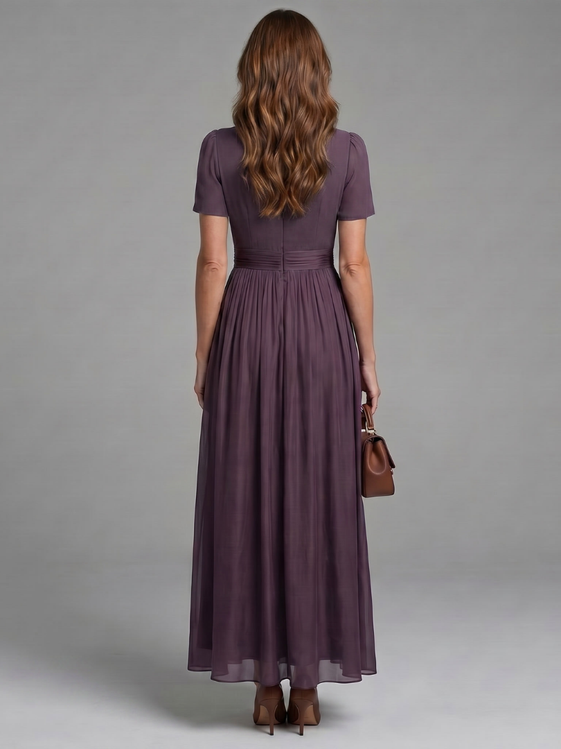 Purple maxi dress with keyhole front neckline, ruched body and flowing skirt