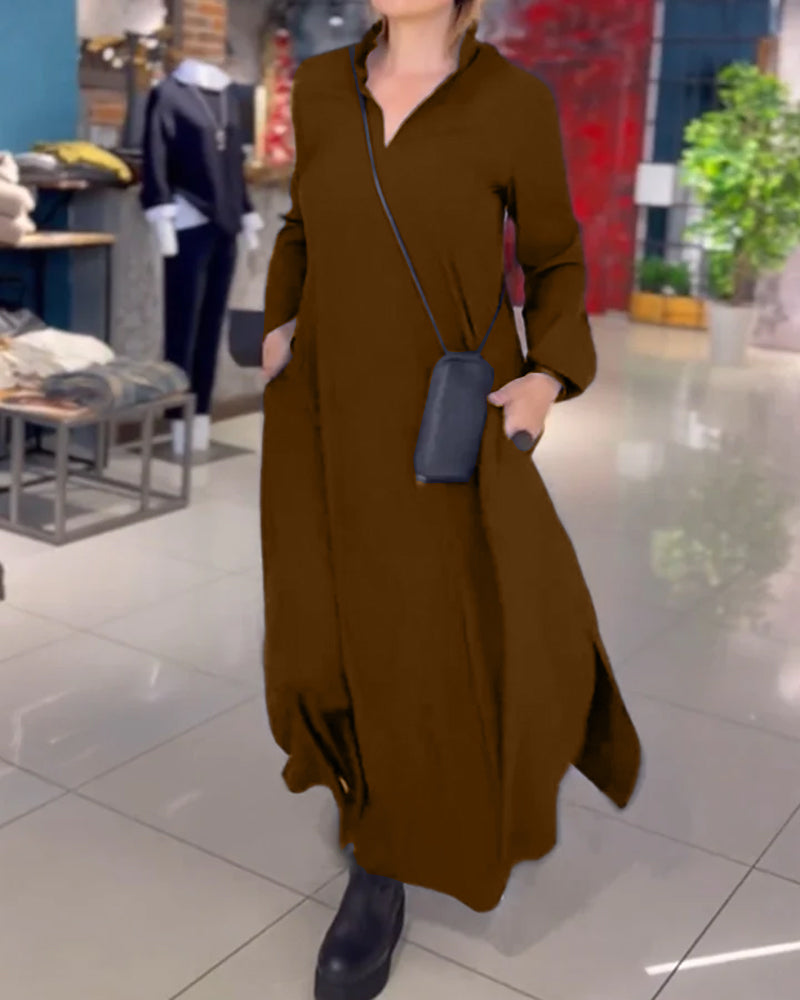 Woman wearing the Sarah relaxed maxi dress with revere collar, standing by a doorway.