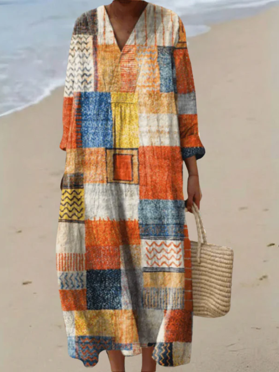 A sleeveless summer patchwork stripe dress in vivid electric blue, pink, green and purple