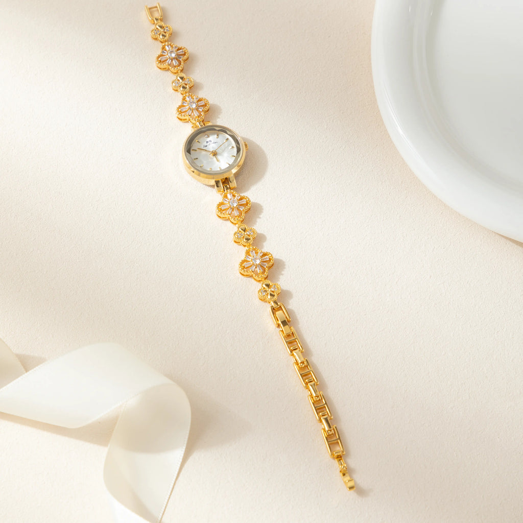 Women's gold-finish watch with rounded design and light-catching detailed face