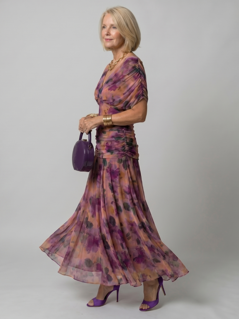 Purple off-shoulder midi dress with draped neckline and gently flared skirt