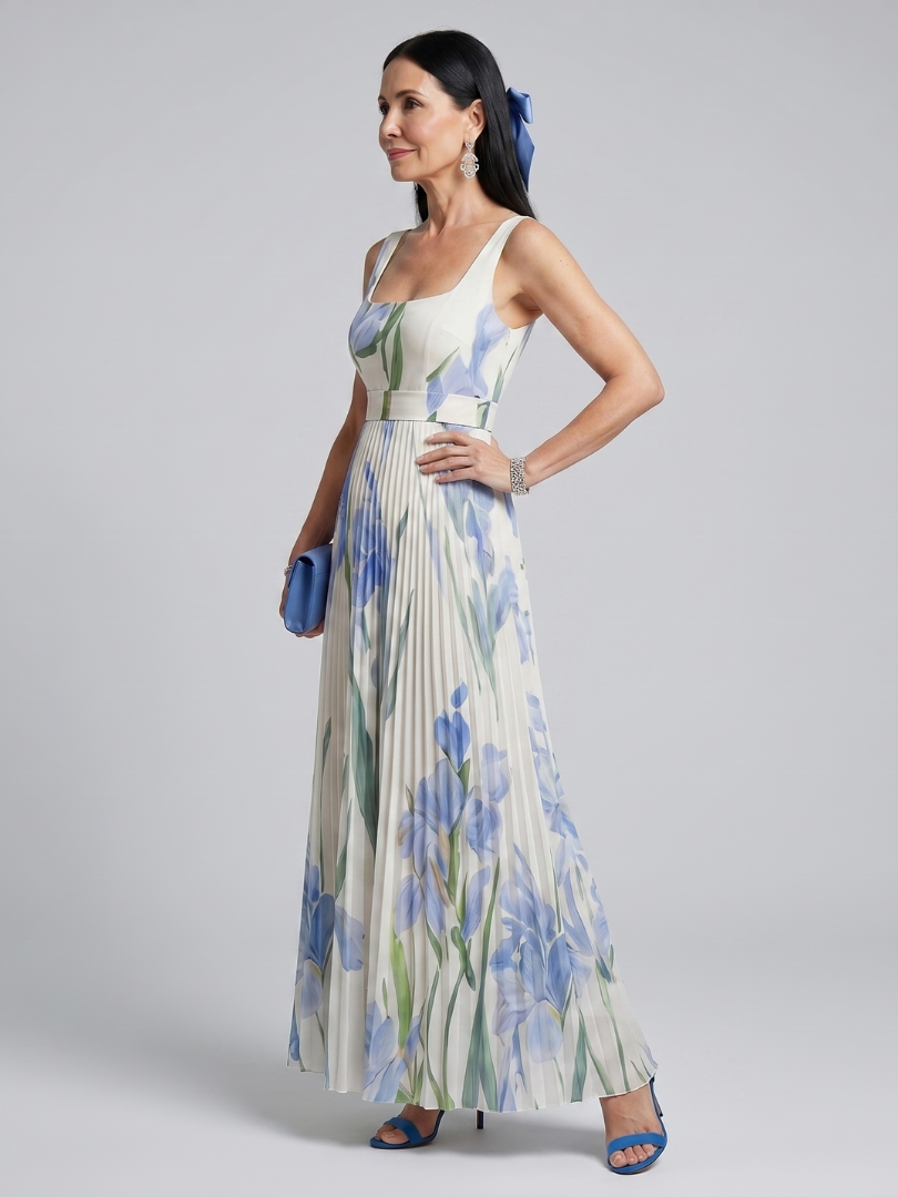 White floral midi dress with a square neckline and pleated flowing skirt