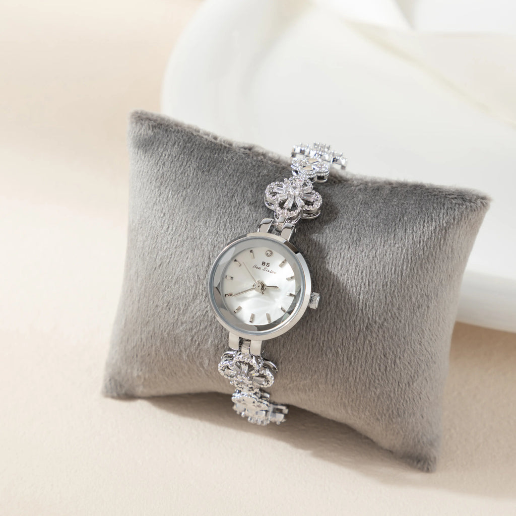 Women's gold-finish watch with rounded design and light-catching detailed face