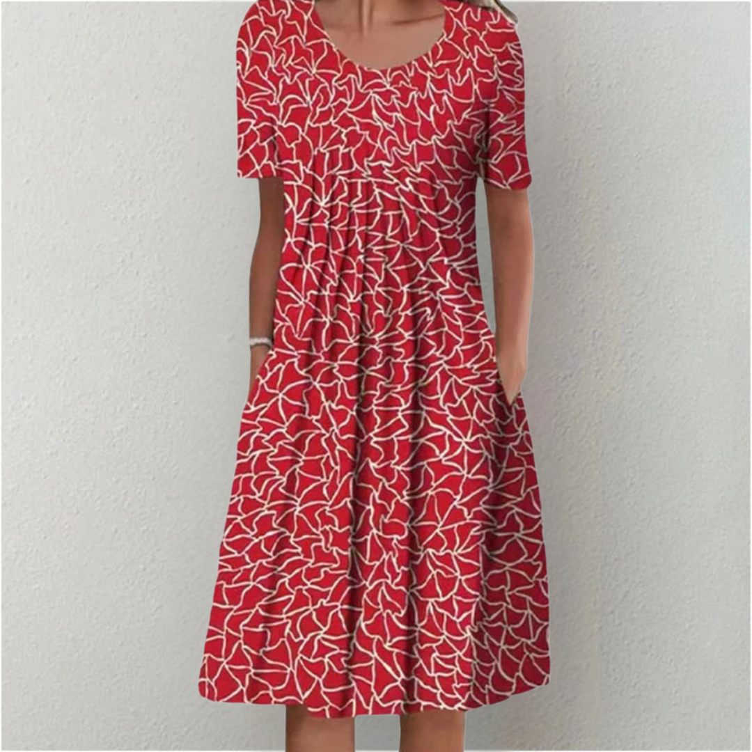 Woman wearing the floral midi dress with pockets, walking outdoors on a sunny day.