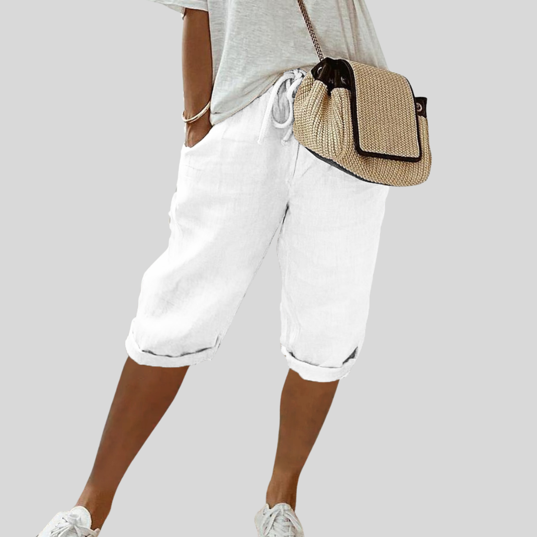 Wide-leg high-waist trousers in a neutral beige tone
