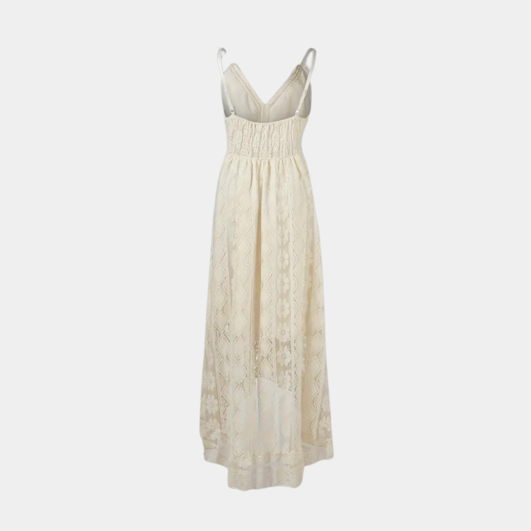 Woman wearing the Alice™ elegant boho midi dress with intricate detailing and a V-neckline at a summer garden party.