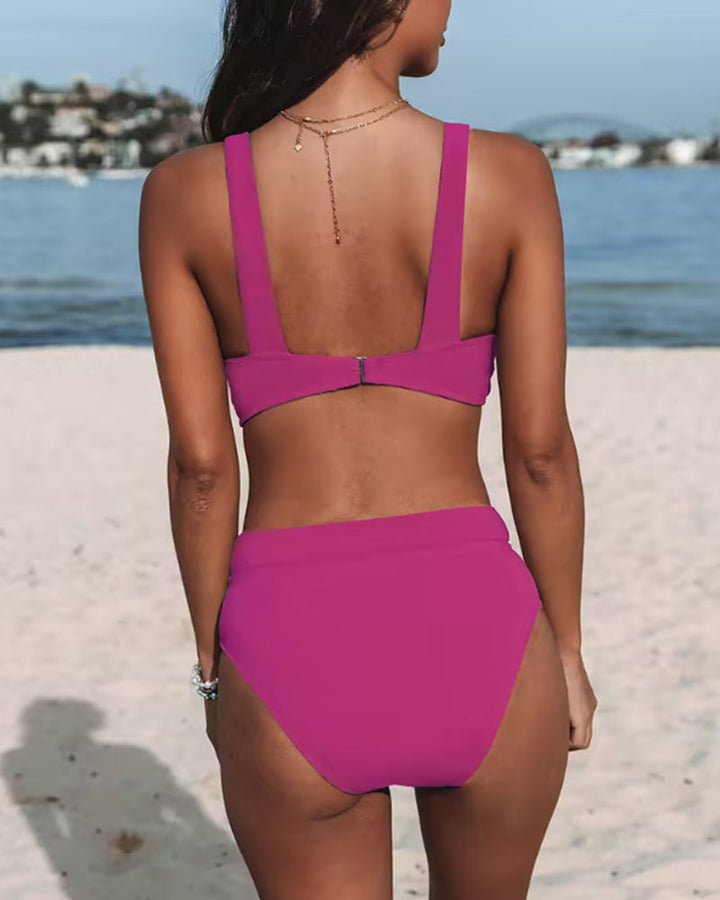 High-leg one-piece swimsuit with V neckline in black, displayed on a model