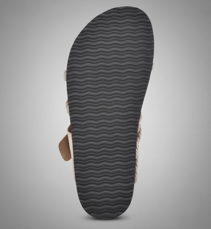 Natural woven flat sandal with an adjustable buckle strap and cushioned footbed