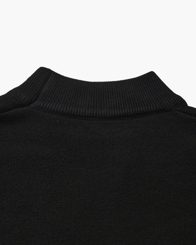 Men's black ribbed roll-neck jumper with a clean structured silhouette