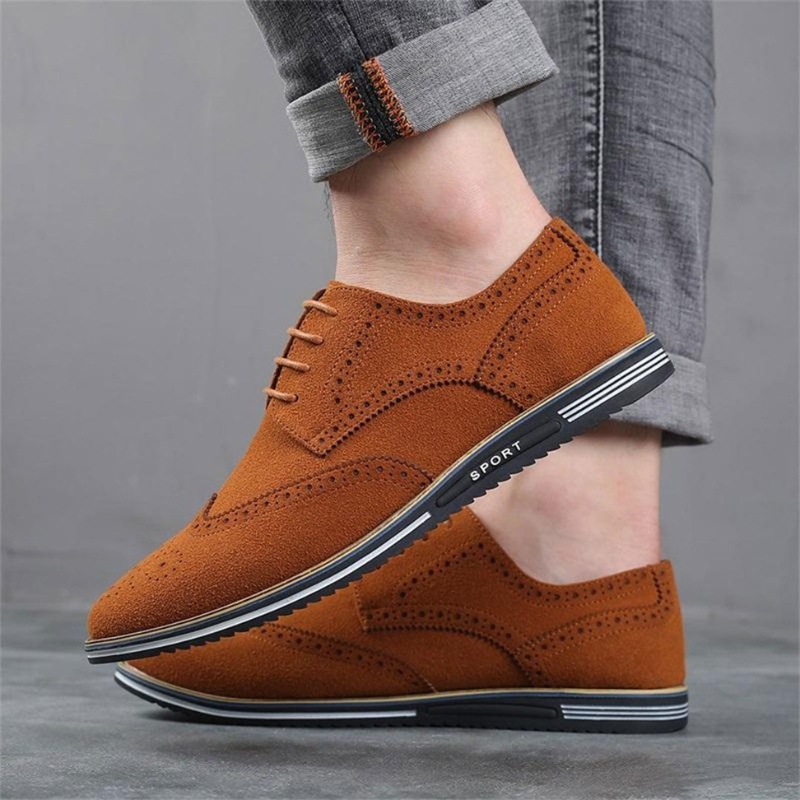 Men's black luxury dress shoes with a sleek pointed silhouette and polished smooth upper