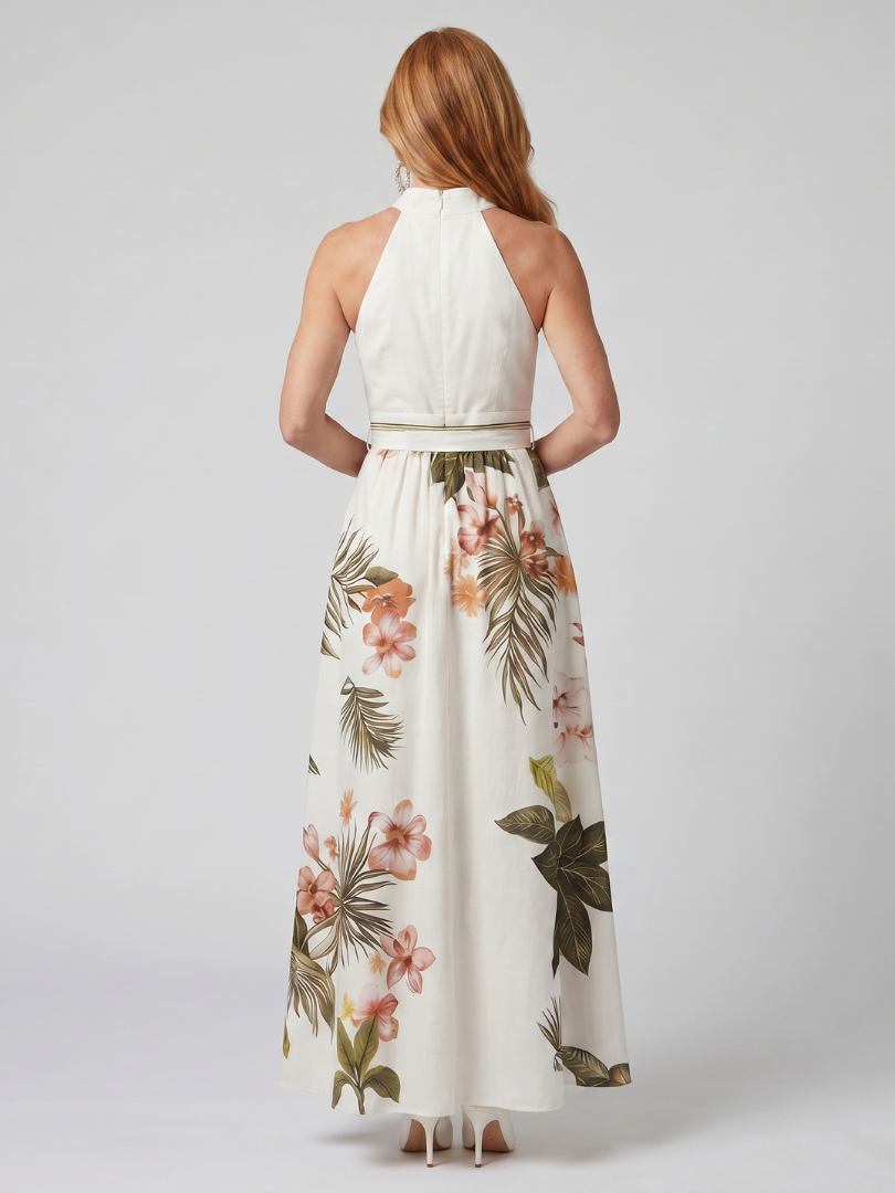 White botanical print halter maxi dress with a draped neckline and bow waist detail