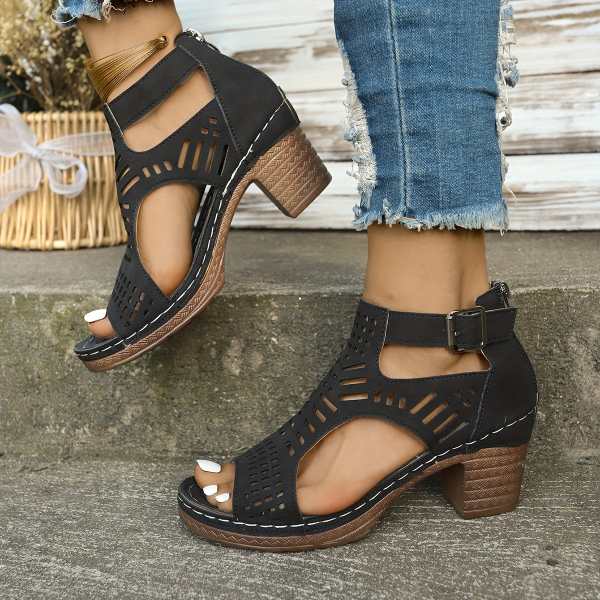 Navy block heel sandals with cutout detail and back fastening