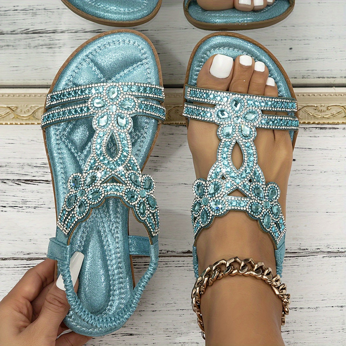 Flat sandals with a rhinestone embellished upper and elastic ankle strap in sky blue, blue, grey, black, white, apricot and gold