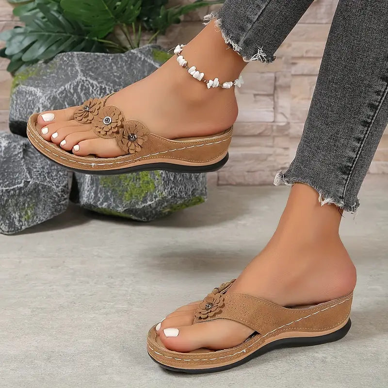 Women's floral toe-post sandals with a soft cushioned base in dark brown, black, navy, red and rose