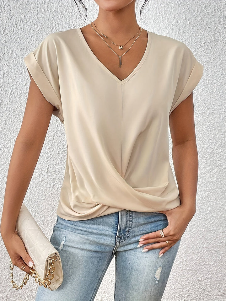 Pink V-neck top with a crossover-front detail and a relaxed, flattering silhouette