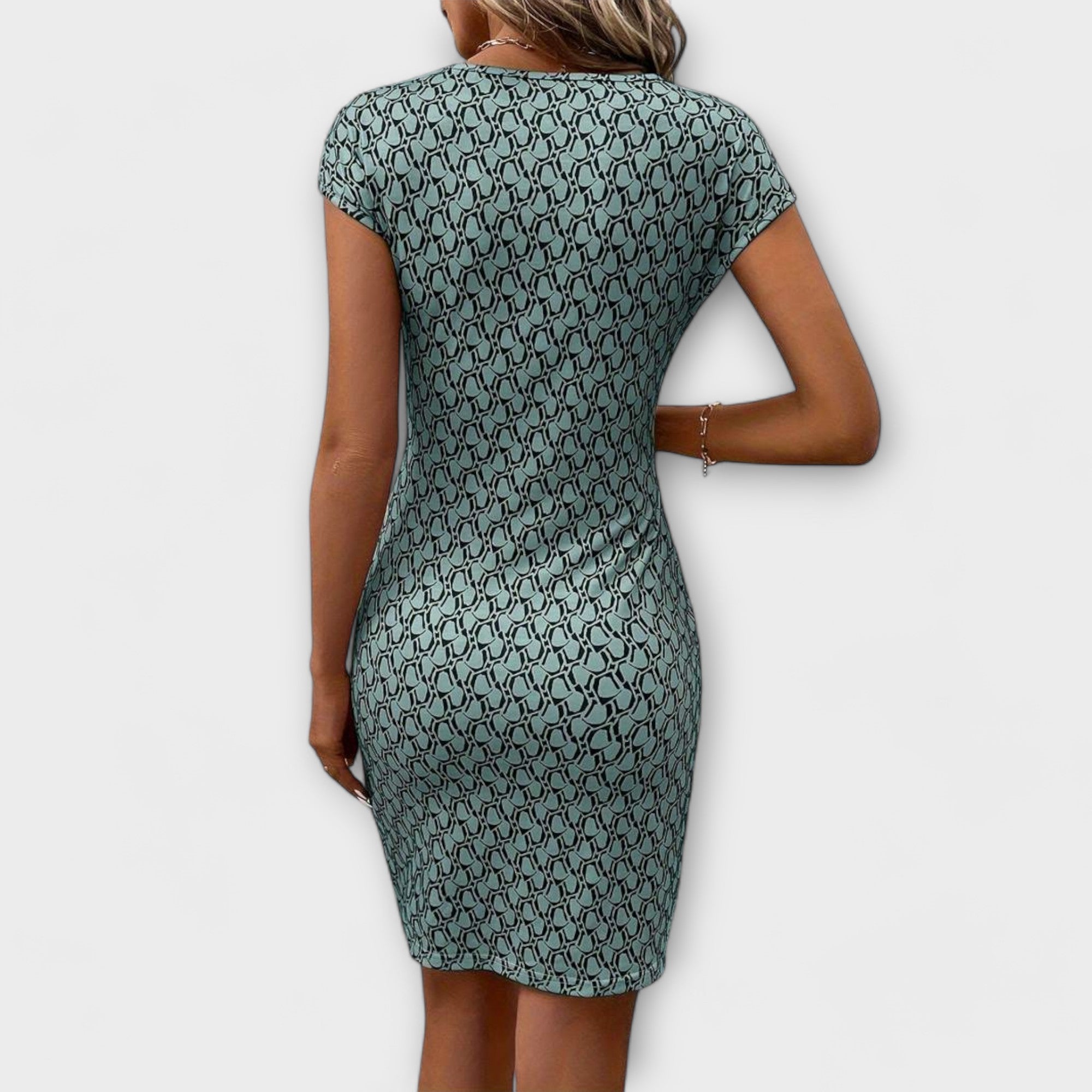 Fitted tulip-cut dress in white, shown in a clean elegant style