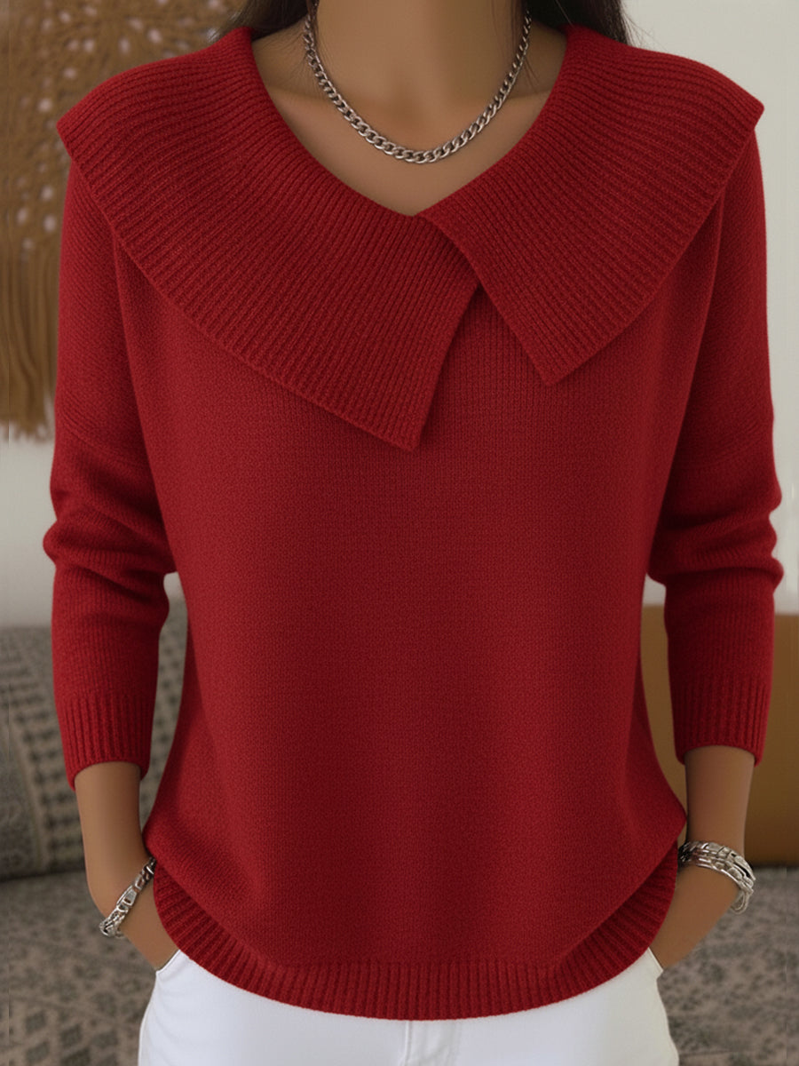 A woman wearing a soft collared jumper styled elegantly for a festive occasion.