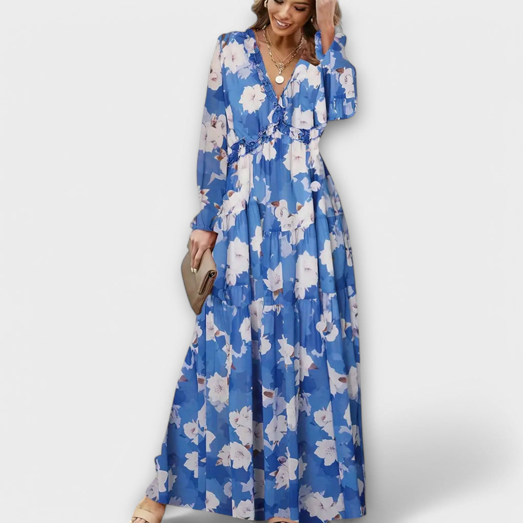 Flowing floral maxi dress with long sleeves and a V-neckline in soft blush pink