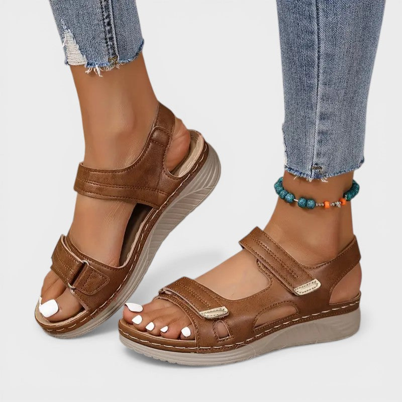 Cushioned comfort sandals in beige and black with adjustable velcro straps