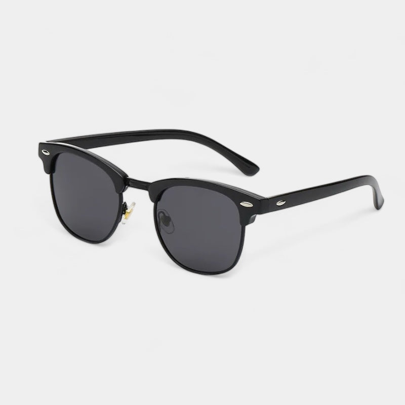 Men's vintage classic sunglasses in black and gold with a refined, understated frame