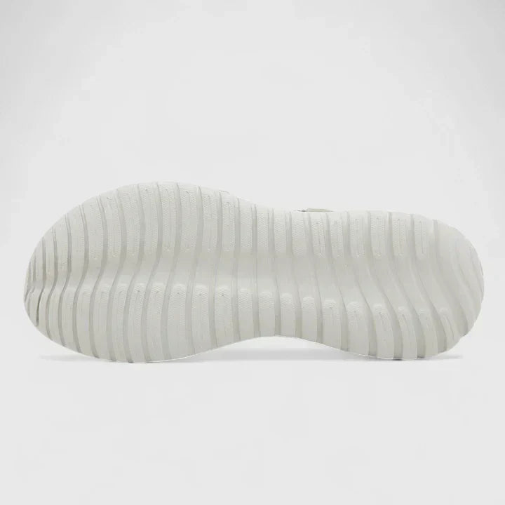 Blue open-toe sandals with woven stretch straps and a broad, cushioned white sole.