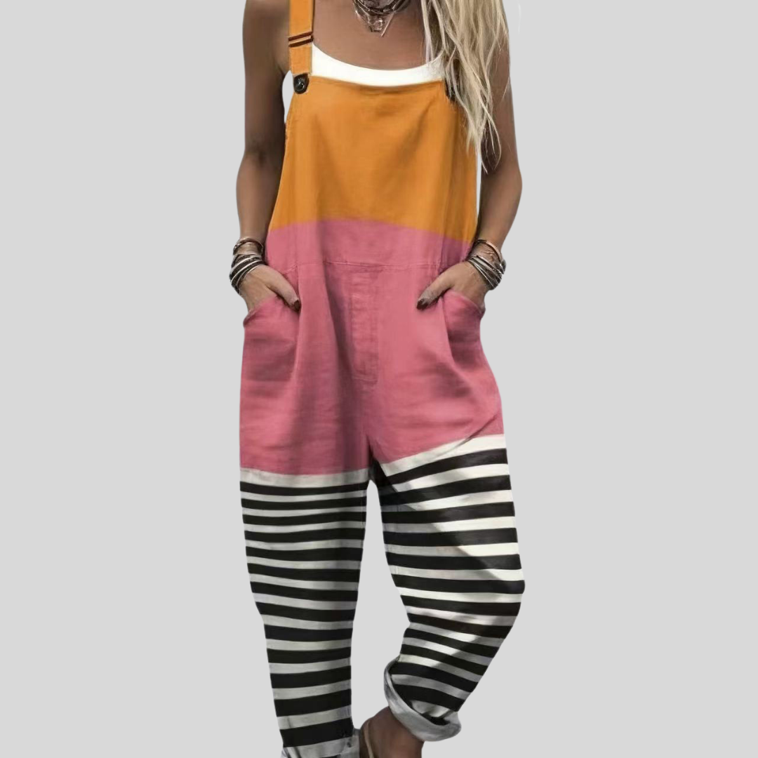 Gobnait™ dungarees in a colour-block of warm orange and blush pink with black-and-white striped wide-leg trousers.