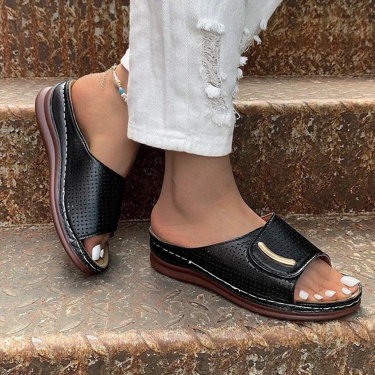 Open-work wedge sandals in bordeaux with a small metallic ornament on the upper