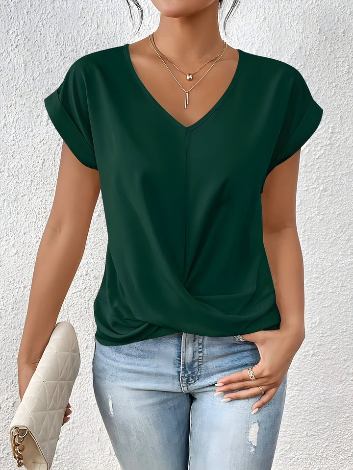 Pink V-neck top with a crossover-front detail and a relaxed, flattering silhouette