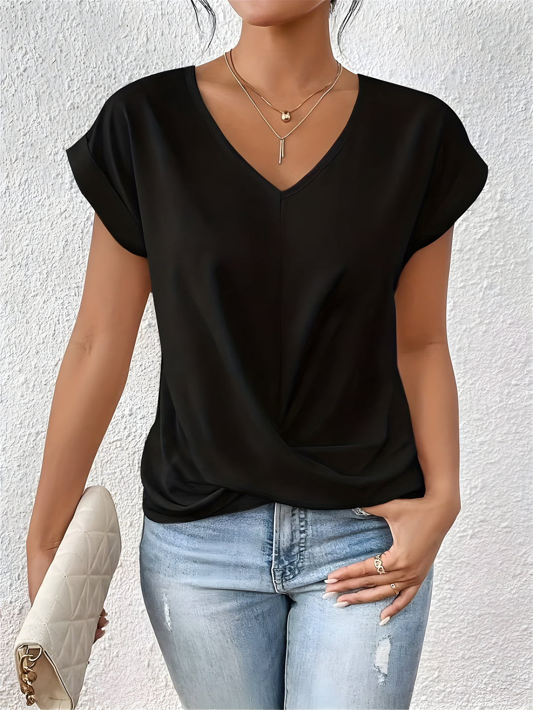 Pink V-neck top with a crossover-front detail and a relaxed, flattering silhouette