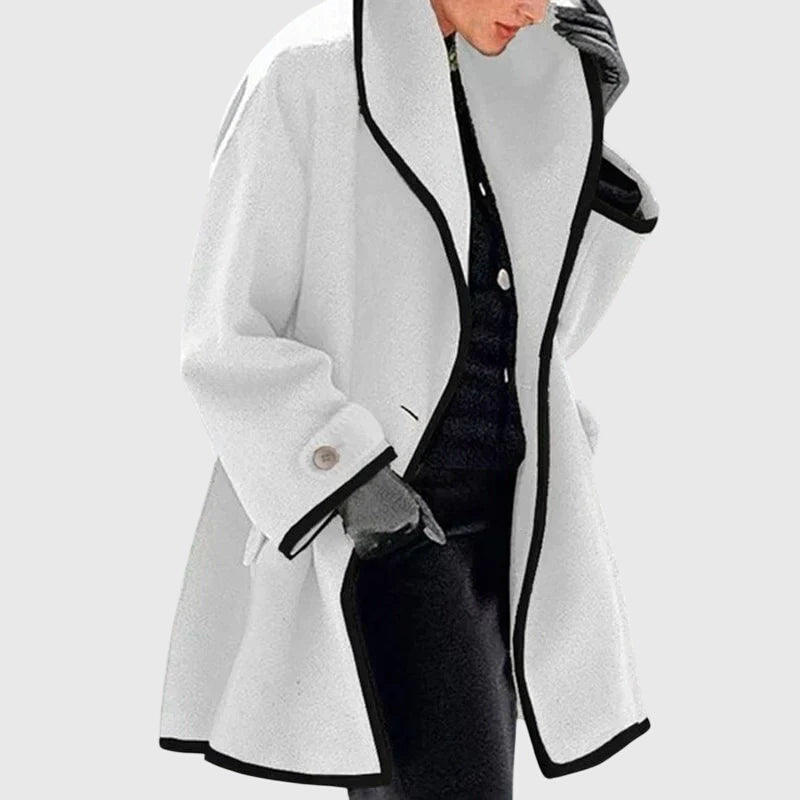 A woman wearing a double-breasted buttoned jacket on a cold day