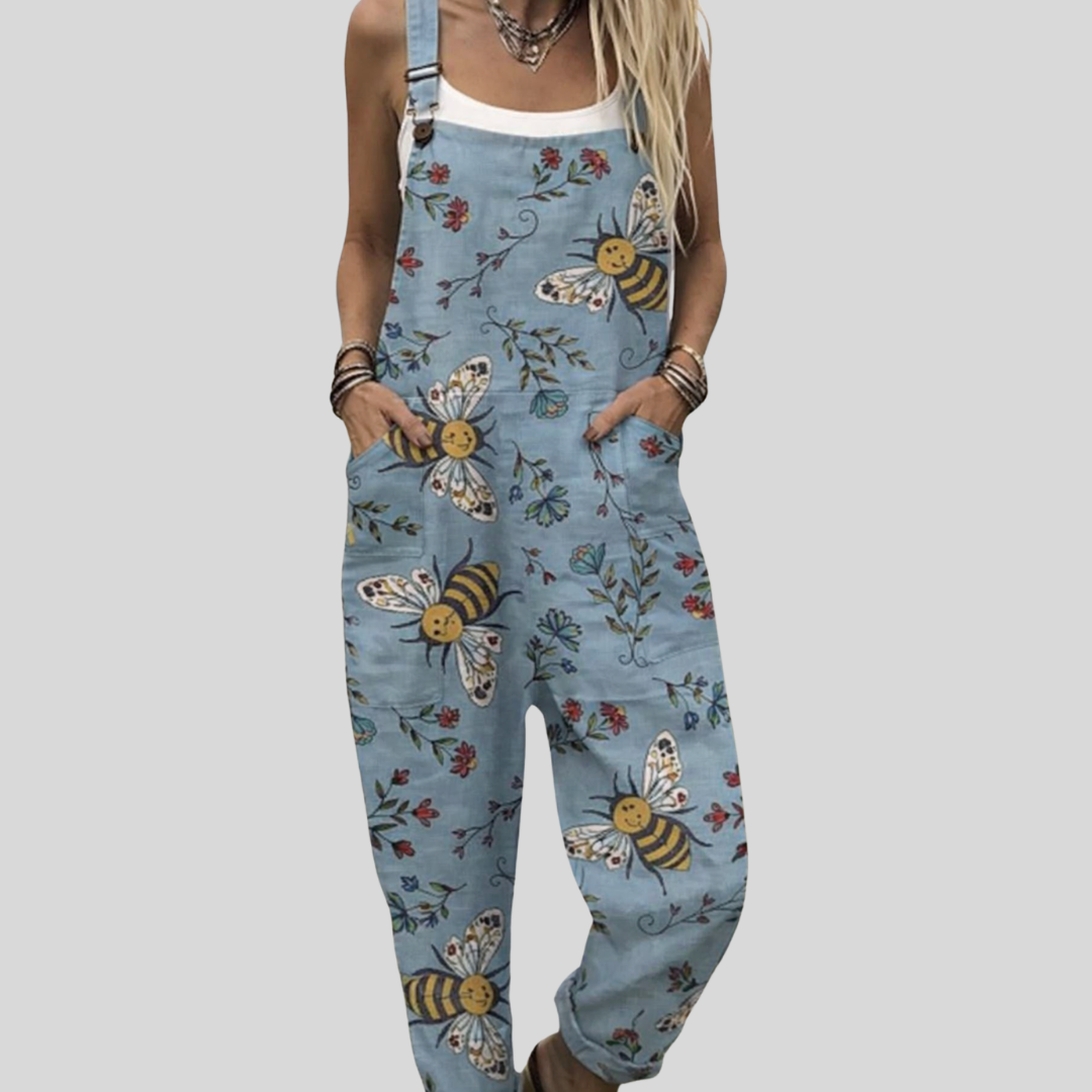 Relaxed wide-leg light blue dungarees with bee, butterfly and blossom print, adjustable straps, from Mary Cork Ireland.